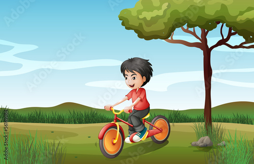 A boy biking at the hill