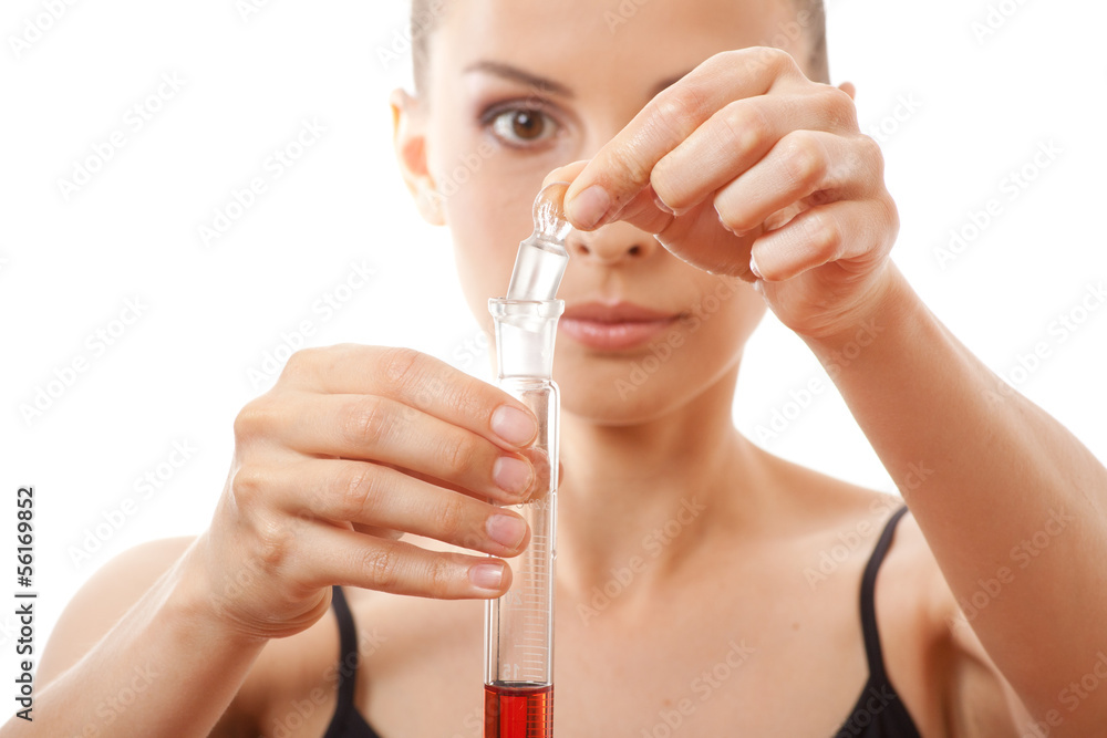 woman holding test tube with red liquid woman holding test tube with red liquid