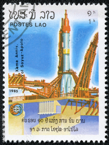stamp printed in Laos shows Soviet rocket on launch pad