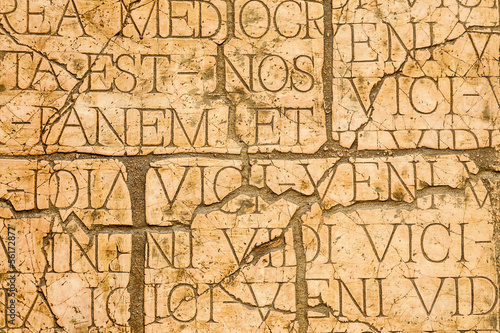 Cracked plaque with Latin inscriptions and Roman letters