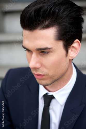 Portrait of a handsome young man in suit and tie