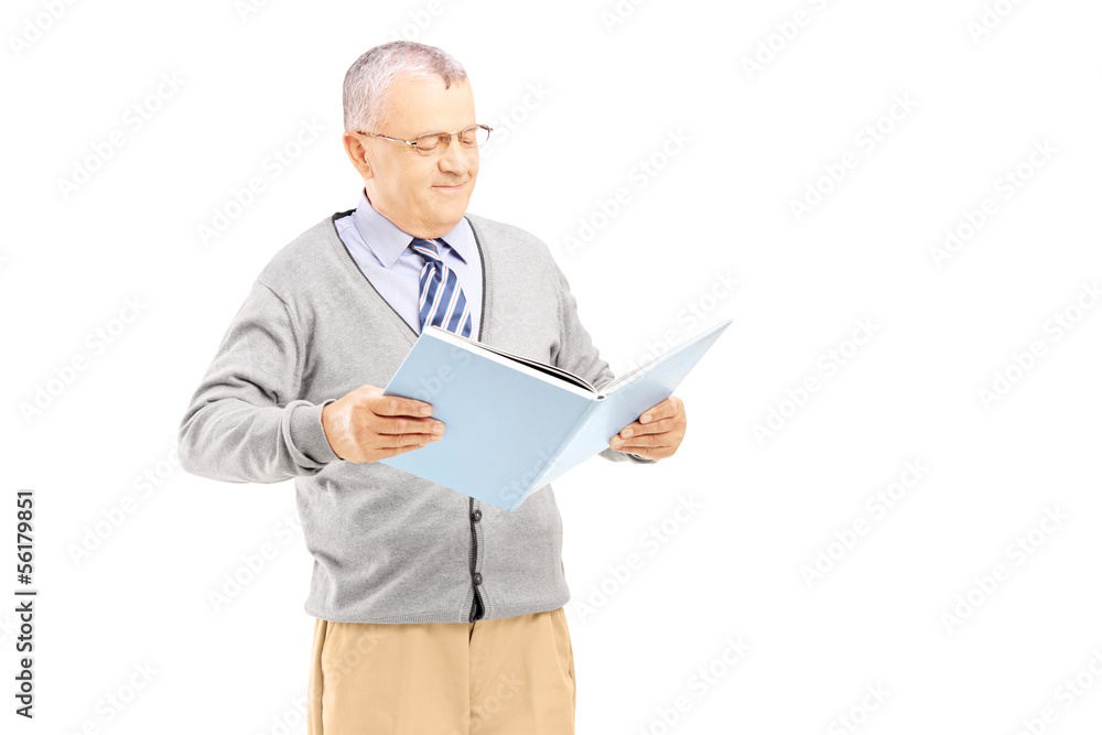 Smiling middle aged gentleman reading a book