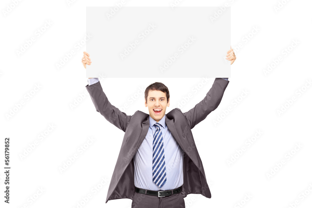 Young smiling businessman holding a blank panel Young smiling businessman holding a blank panel