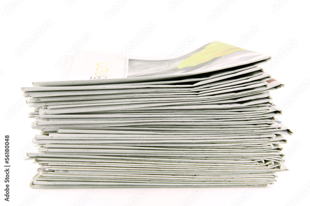 pile of newspapers isolated on white background pile of newspapers isolated on white background