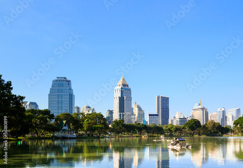 Business district cityscape from a park with blue sky