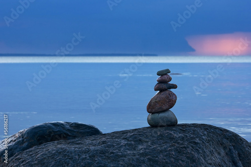 Canvas Print balanced stones at the sea