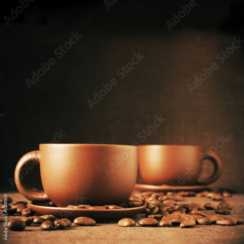 Cups of coffee and coffee beans