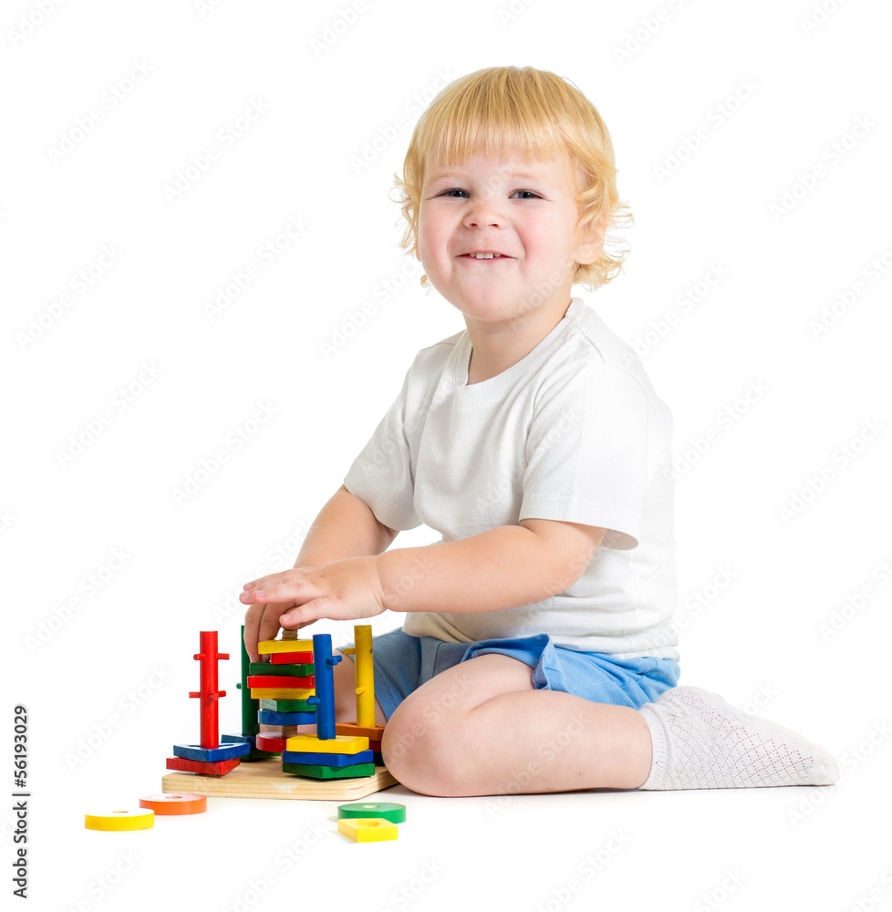 Happy child playing logical educational toys Happy child playing logical educational toys