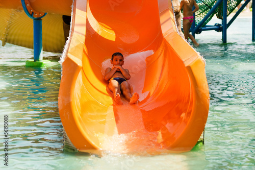 Boy having fun on toboggan photo