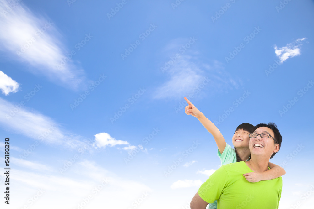 Happy family looking and pointing with cloud background Happy family looking and pointing with cloud background