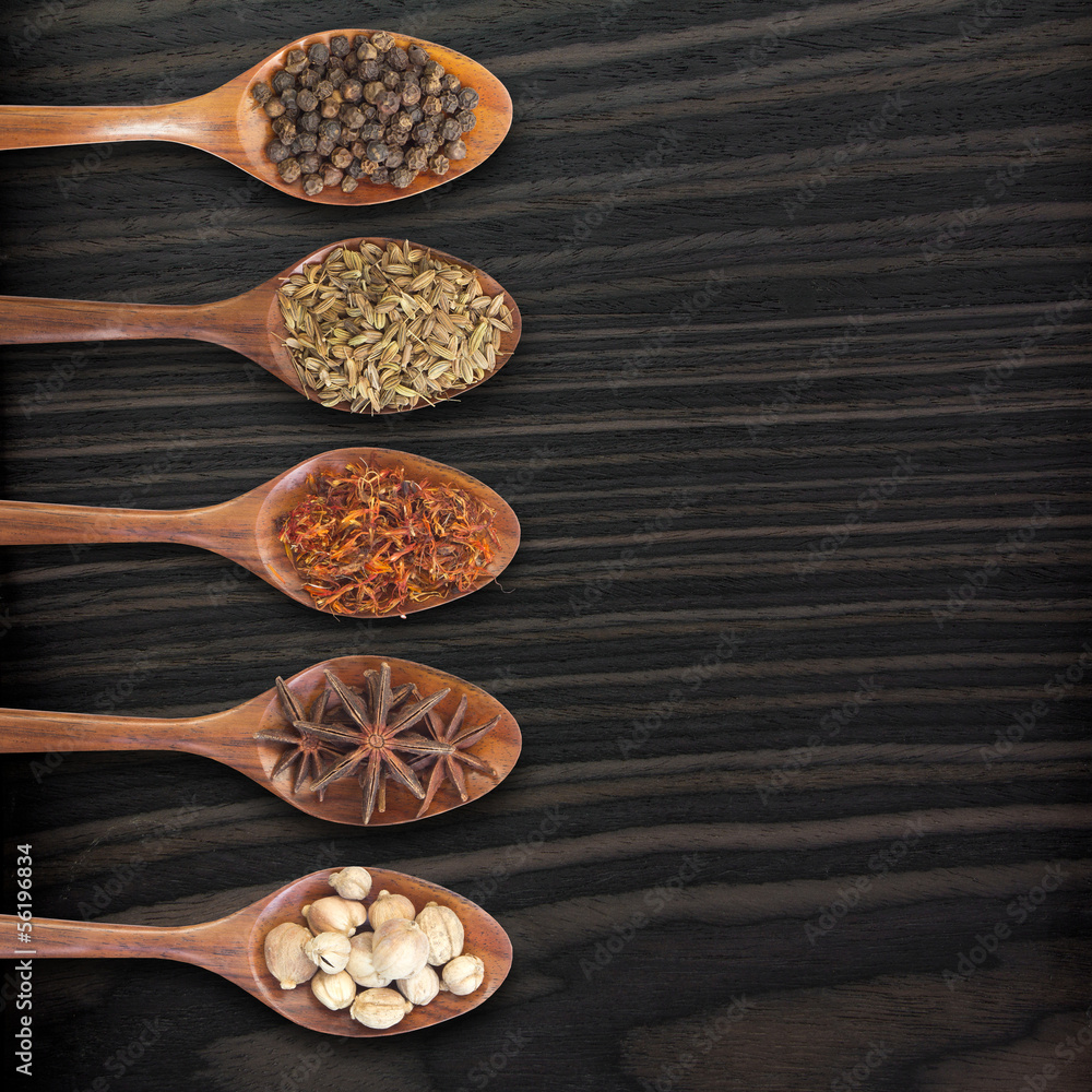 Set of 5 spices on a wooden spoon