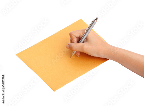 hand with pen writing on the envelope