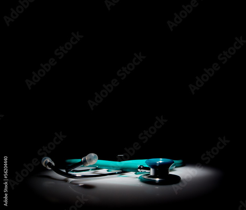 Stethoscope in a spotlight on black background