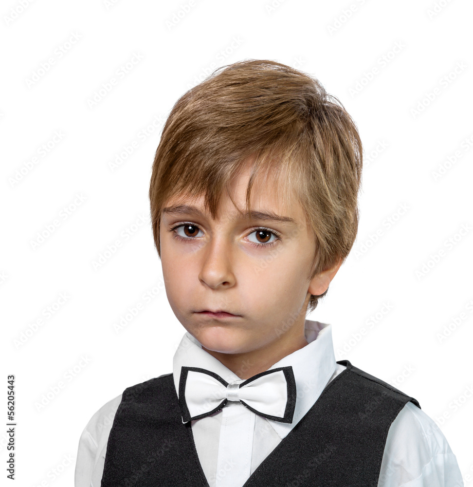 Portrait of a boy in a jacket with a bow tie. Portrait of a boy in a jacket with a bow tie.