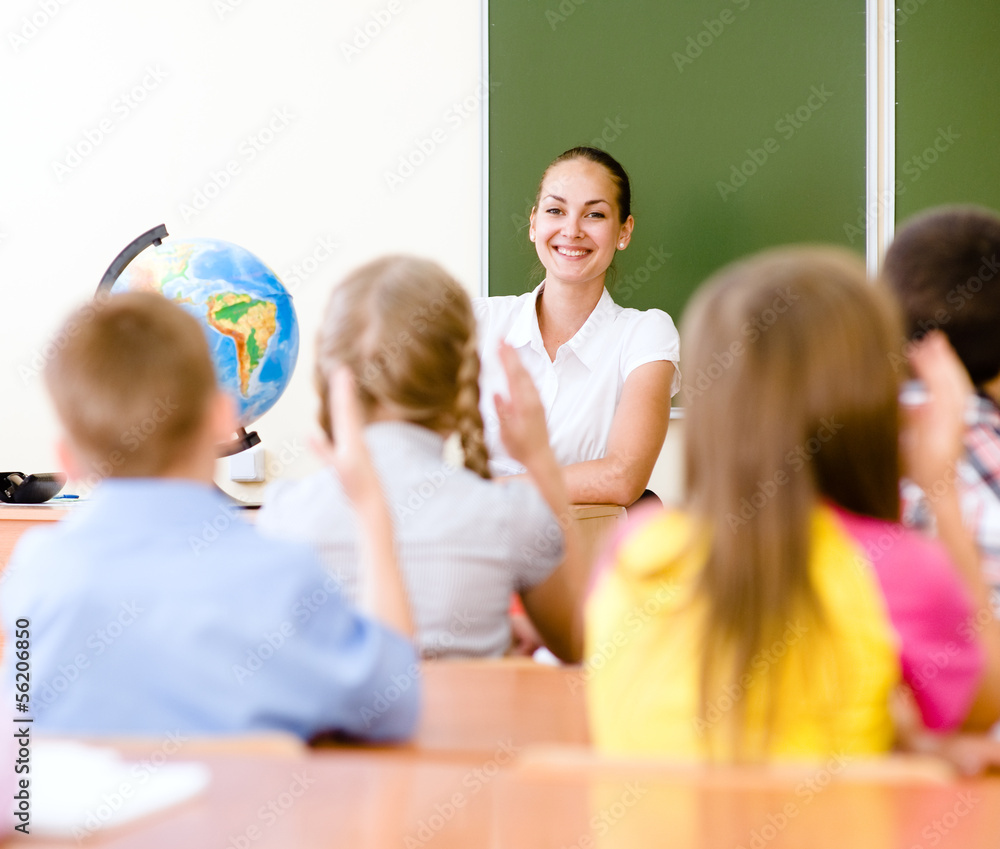 Fototapeta premium School children in classroom at lesson
