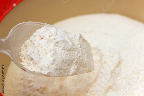 Plastic spoon hold flour.