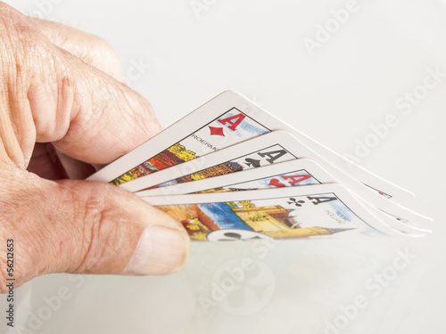 playing cards in hand as a background
