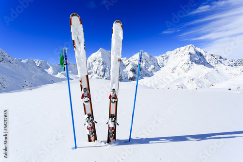 Ski, winter season, mountains and ski equipments on ski run