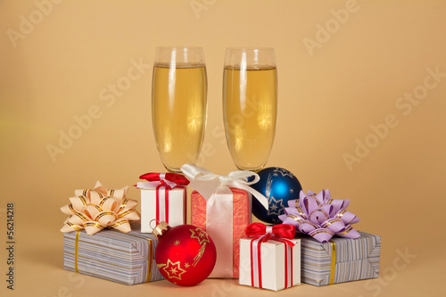 Two wine glasses, gift boxes and Christmas toys