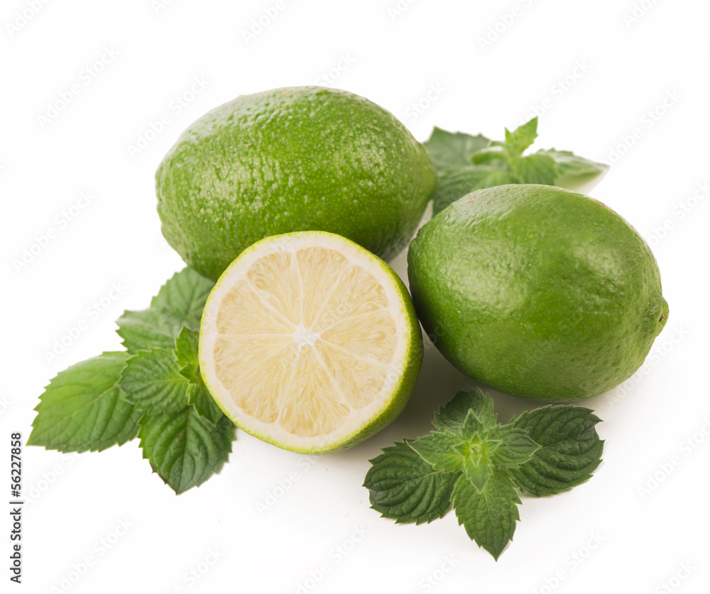 Fresh limes, mint leaves isolated on white Fresh limes, mint leaves isolated on white