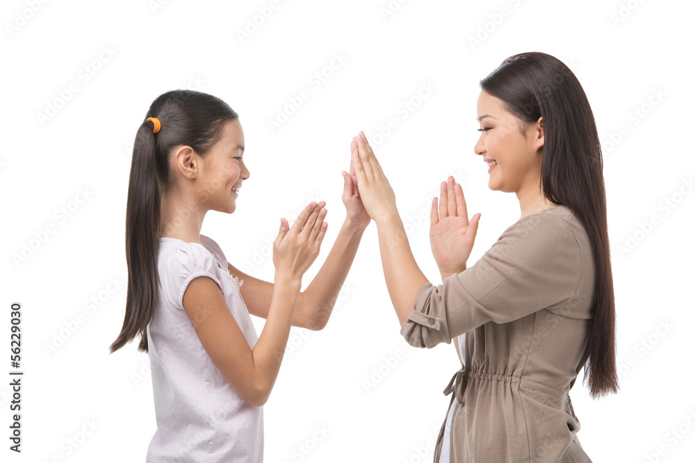 Mother and daughter. Cheerful mother and daughter playing togeth Mother and daughter. Cheerful mother and daughter playing togeth