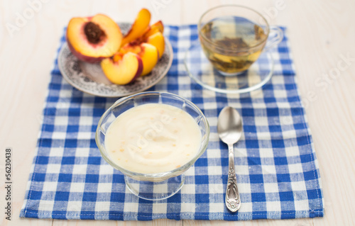 Breakfast. Green tea, youghurt and peach