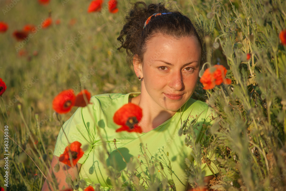 Naklejka premium Young beautiful woman on cereal field in summer