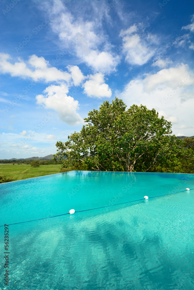 Infinity swimming pool in beautiful landscape