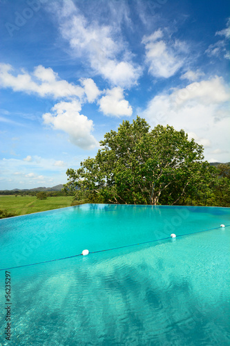 Infinity swimming pool in beautiful landscape © surangaw