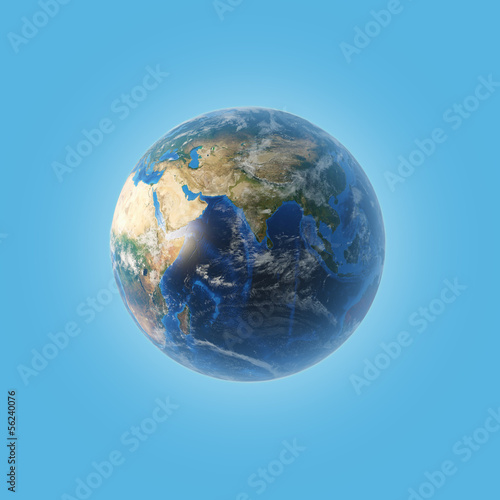 Planet earth with some clouds over a blue background