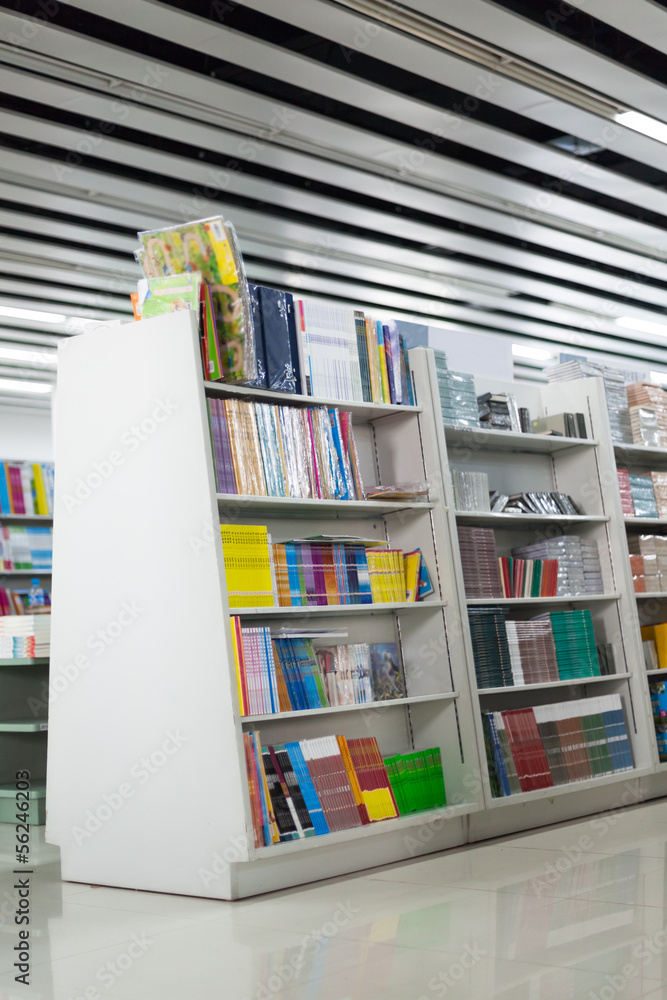 Naklejka premium The aisles in a public library with shelves full of books