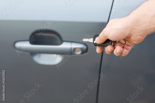 man with car key outside