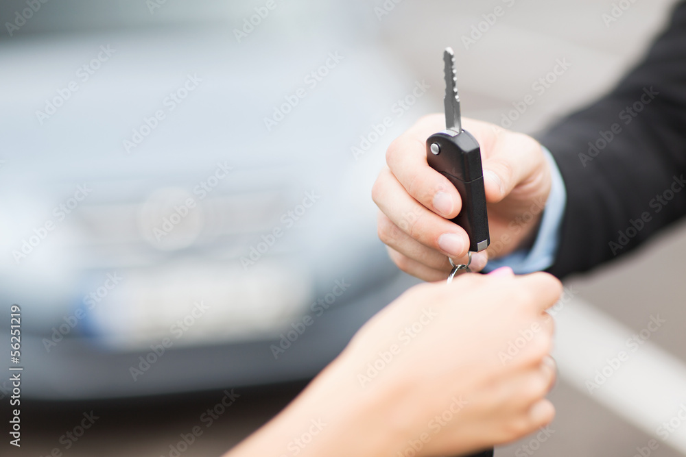customer and salesman with car key customer and salesman with car key