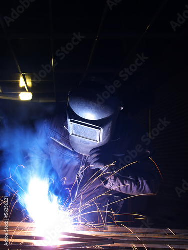 Welder on the workplace. Construction and manufacturing