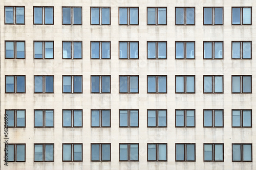 Multiple closed windows on a large office building photo