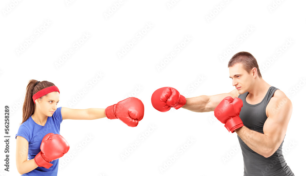 Female and male boxers with boxing gloves during a match Female and male boxers with boxing gloves during a match