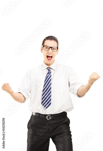 Happy male with tie gesturing happiness and looking at camera