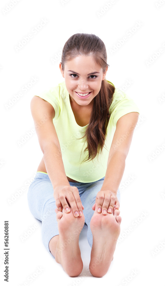 Beautiful young girl doing exercises isolated on white Beautiful young girl doing exercises isolated on white