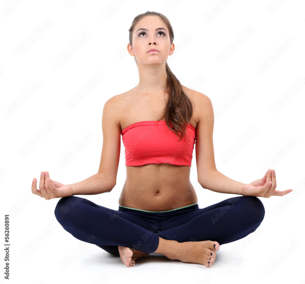 Young beautiful fitness girl doing yoga exercise isolated