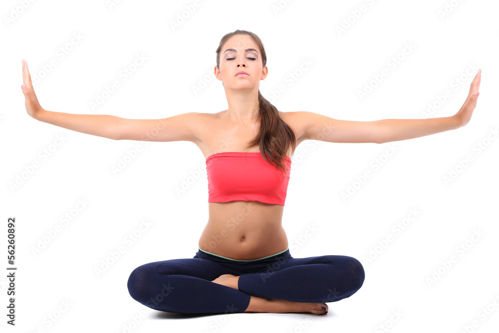 Young beautiful fitness girl doing yoga exercise isolated