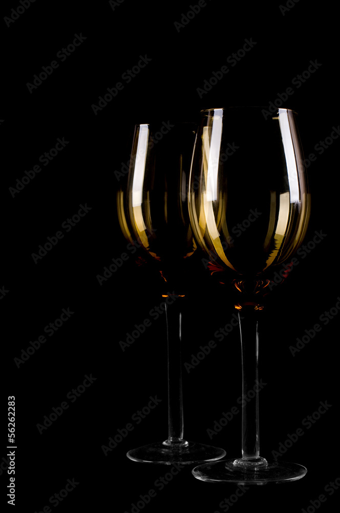 Wine glass silhouette on black background.
