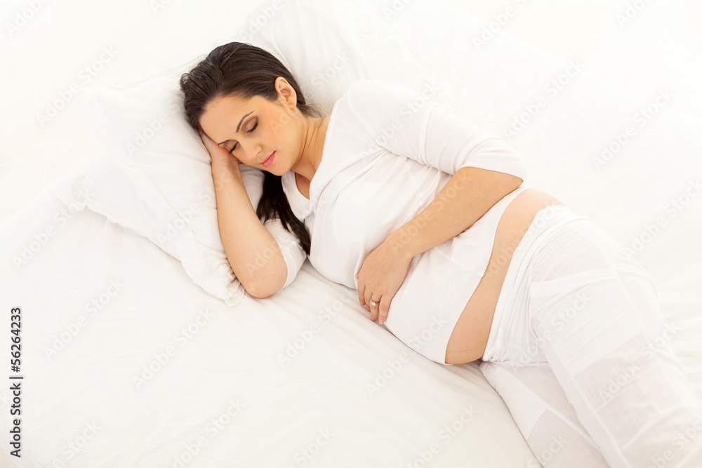 above view of pregnant woman sleeping above view of pregnant woman sleeping