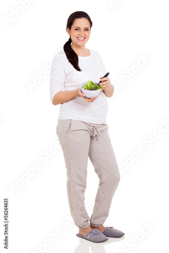 pregnant woman eating fresh salad