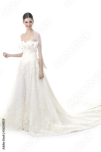 Slim beautiful woman with wearing luxurious wedding dress
