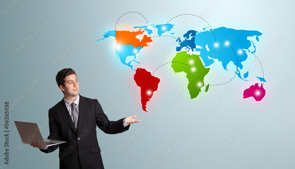 young man holding a laptop and presenting colorful world map young man holding a laptop and presenting colorful world map