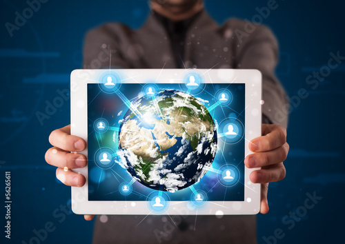 Businessman presenting 3d earth globe in tablet