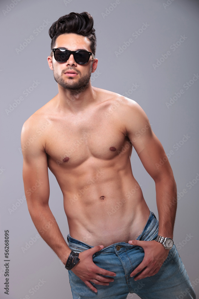 topless man pulling down his pants Stock Photo | Adobe Stock