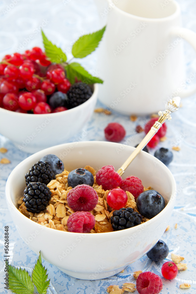breakfast - muesli with berries, milk, selective focus. breakfast - muesli with berries, milk, selective focus.