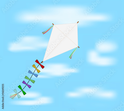 Paper kite flying on blue sky