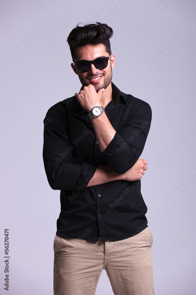 Obraz premium young fashion man with hand on chin